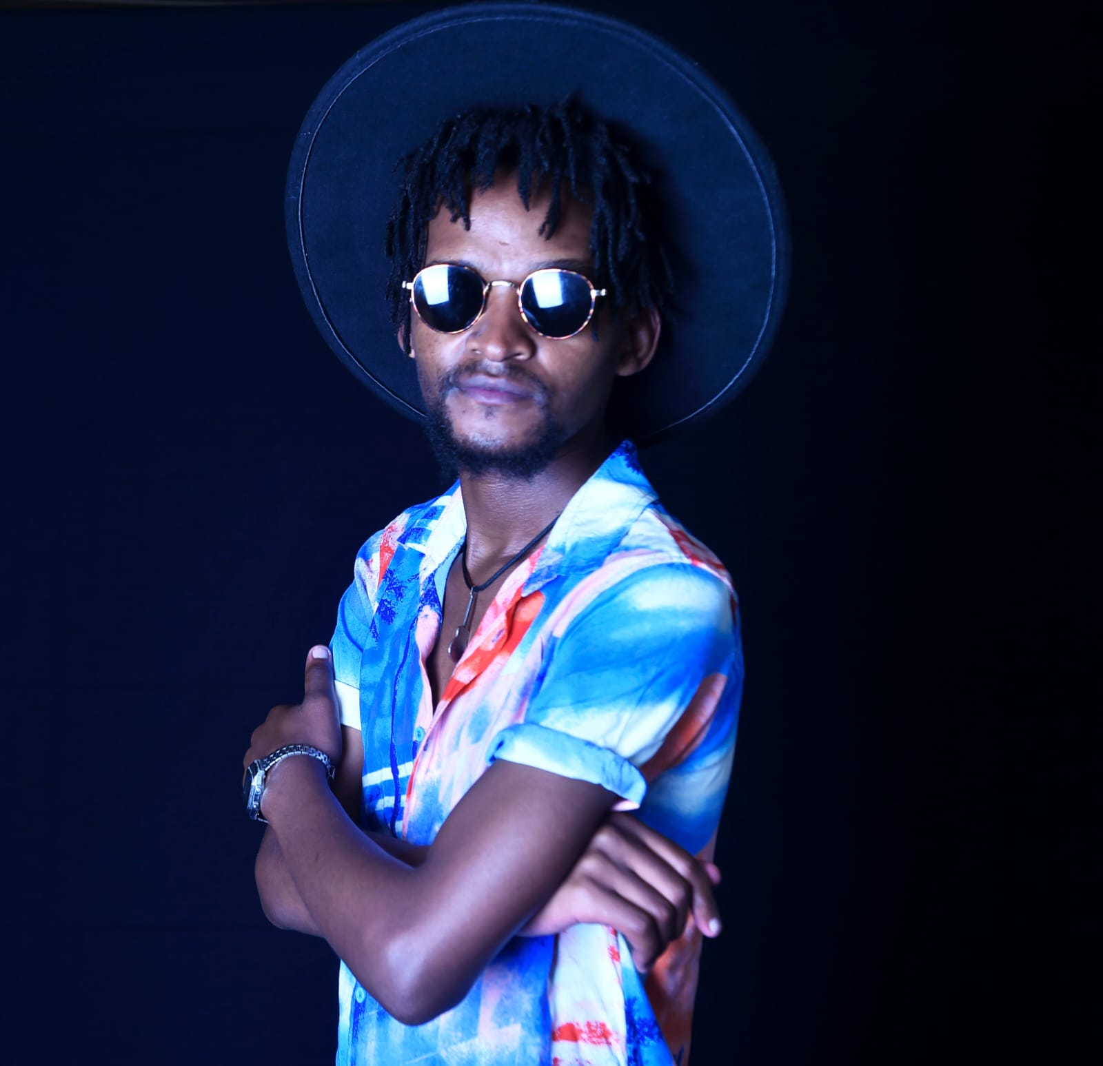A Deepsoulja crew member photographed against a dark studio backdrop.