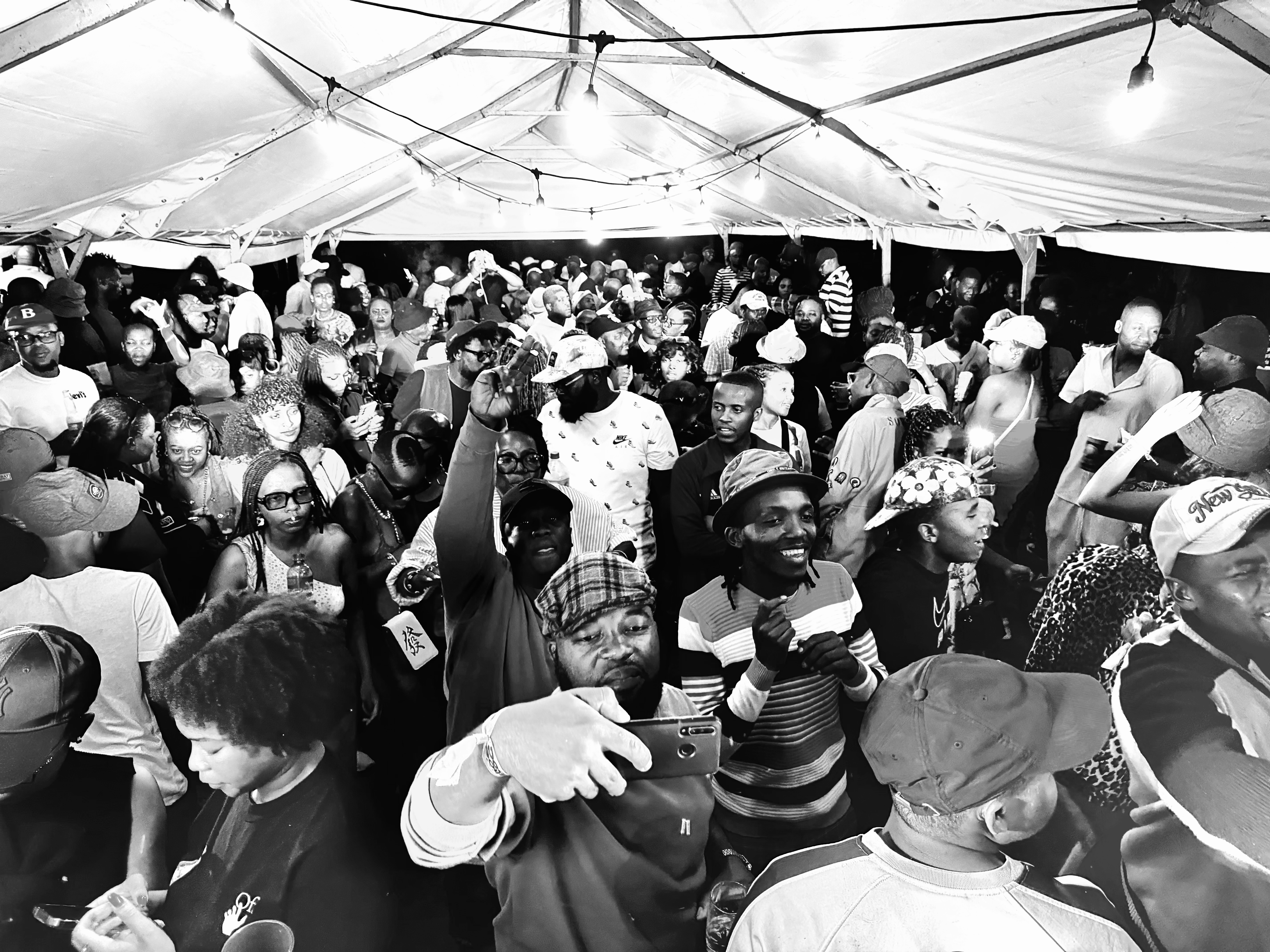 A full Deepsoulja event room with guests gathered close to the music.